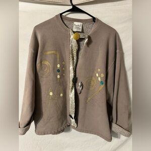 Kunky’s Tan Jacket with Artistic Embellishments